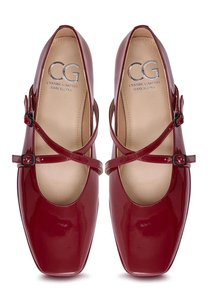 A pair of stylish red leather ballerinas, also known as Albina flats, ideal women's shoes for any occasion.