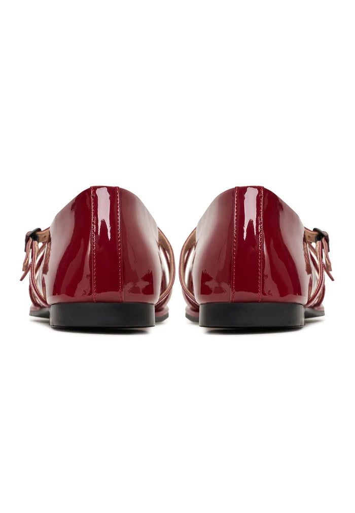 A pair of red leather ballerinas, also known as Albina ballerinas, are elegant women's shoes perfect for any occasion.