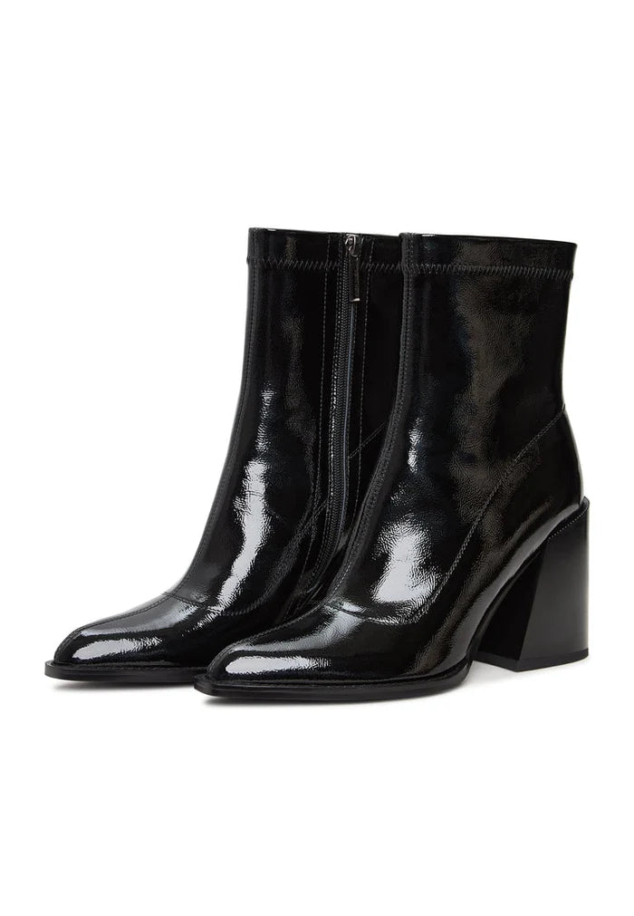 A stylish pair of Layla chunky heel leather block boots in patent black, perfect for any fashion-forward woman's collection.