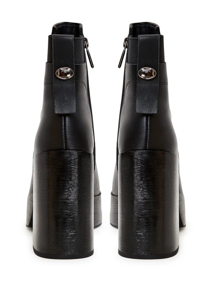 A stylish pair of leather block heeled ankle boots, perfect for any fashionable outfit choice.