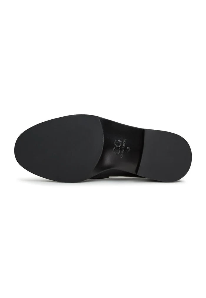 A close-up image of black leather block heeled loafers, perfect for women who love stylish and comfortable leather shoes.
