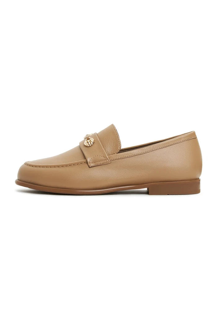 A stylish pair of women's leather block heeled loafers in beige, known as Abigail loafers, for a trendy and chic look.