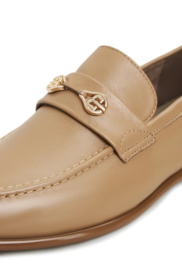 A stylish pair of beige leather block heeled Abigail loafers, perfect for trendy and chic women's shoe collection.