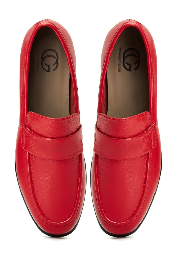 A stylish pair of red leather Abigail loafers with block heels perfect for adding a pop of color to any outfit.