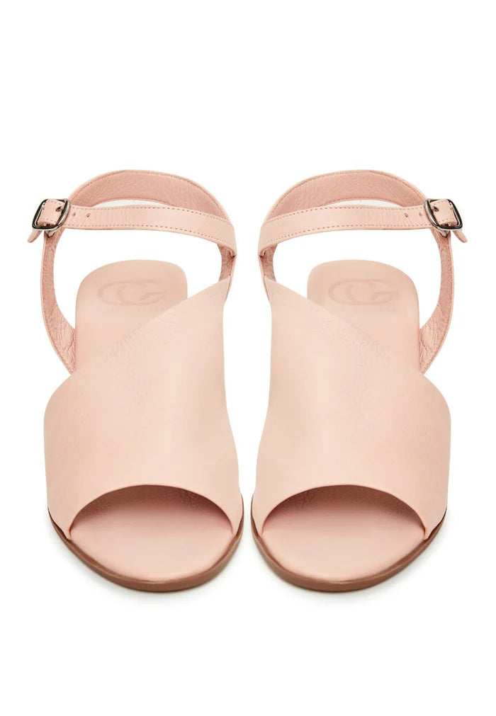 A stylish pair of women's pink leather block heel sandals featuring a chunky heel design perfect for elevating any look.