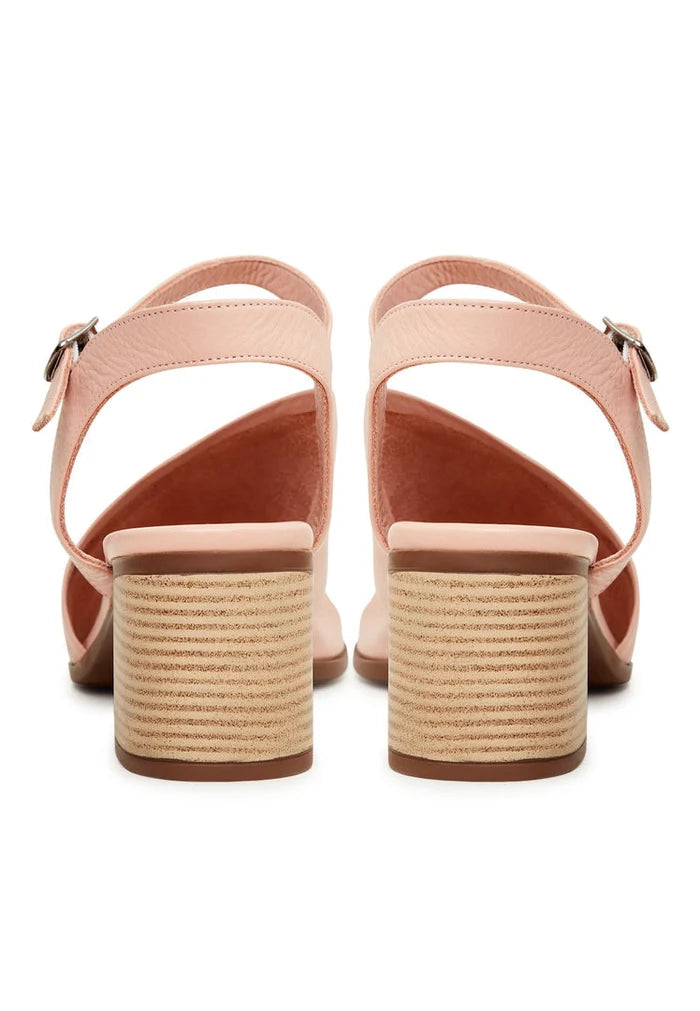 A pair of stylish women's pink leather block heel sandals featuring a chunky heel design, perfect for adding a touch of sophistication to any outfit.