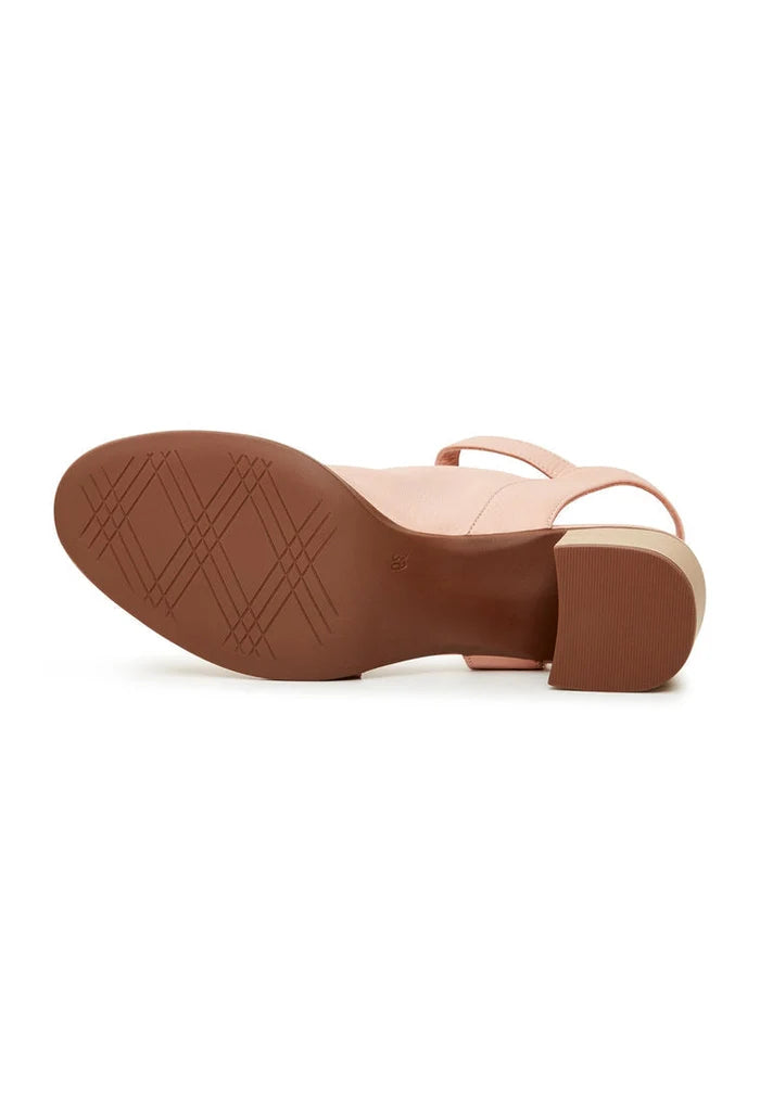 A stylish pair of women's pink leather block heel sandals with a chunky heel design.