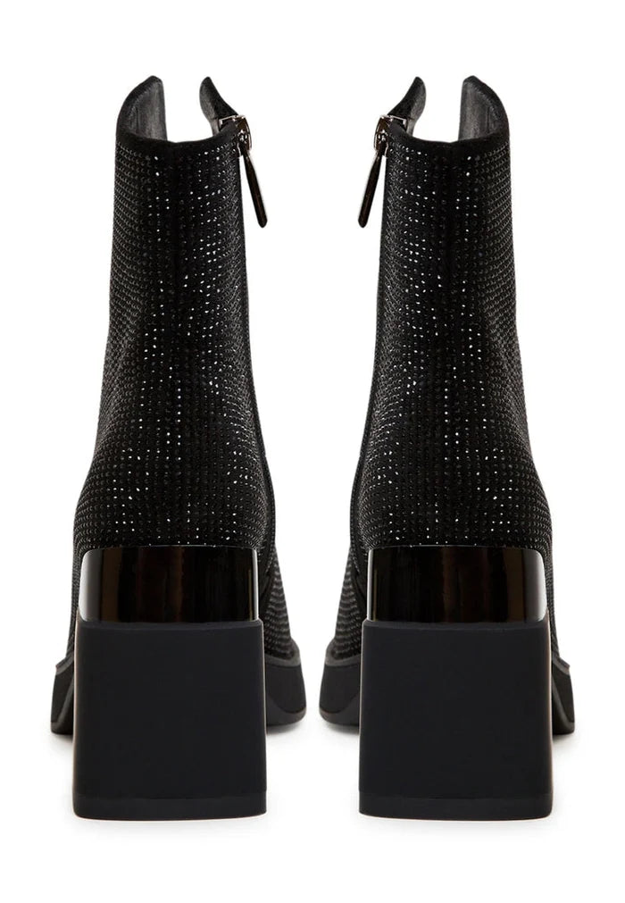 A stylish pair of women's black leather ankle boots with a trendy block heel, perfect for fashionable outfits.