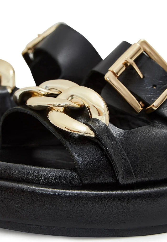 A stylish pair of black leather chain sandals perfect for any casual outfit.