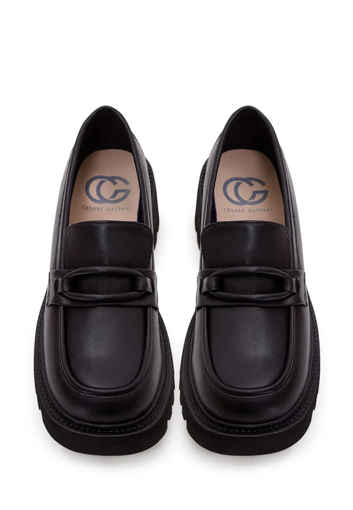 A stylish collection of women's shoes including leather loafers, classic black heels, block heel shoes, and black leather loafers for women.