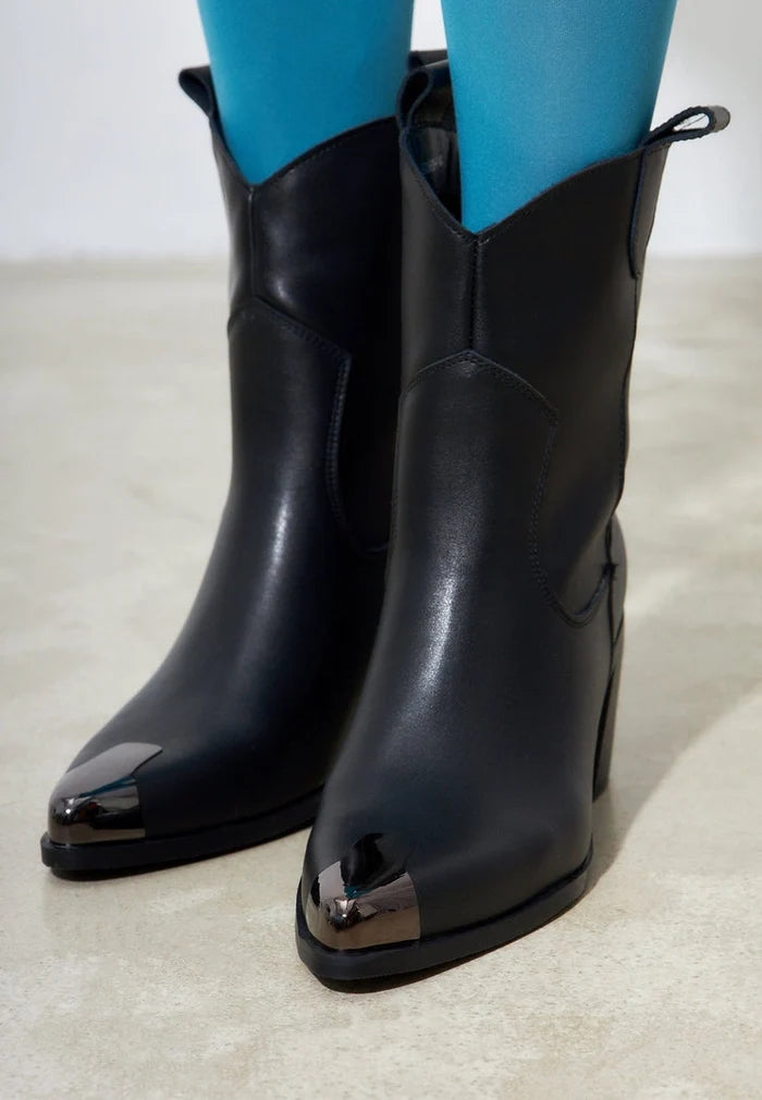 A stylish pair of vintage Western cowboy boots for men, crafted from high-quality handmade leather by a designer brand