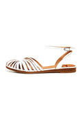 A close-up image of white leather flat sandals for women, perfect for a casual and stylish summer look.