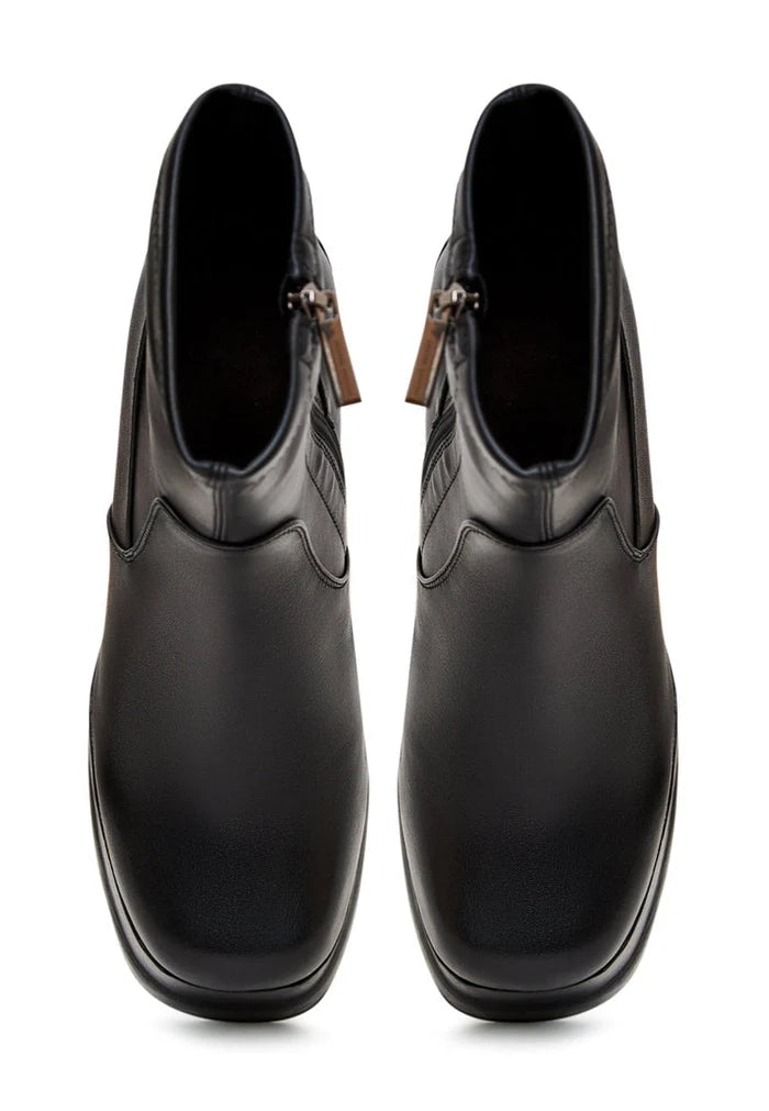 A stylish pair of black leather ankle boots with high heels, perfect for women looking for fashionable leather heeled booties.