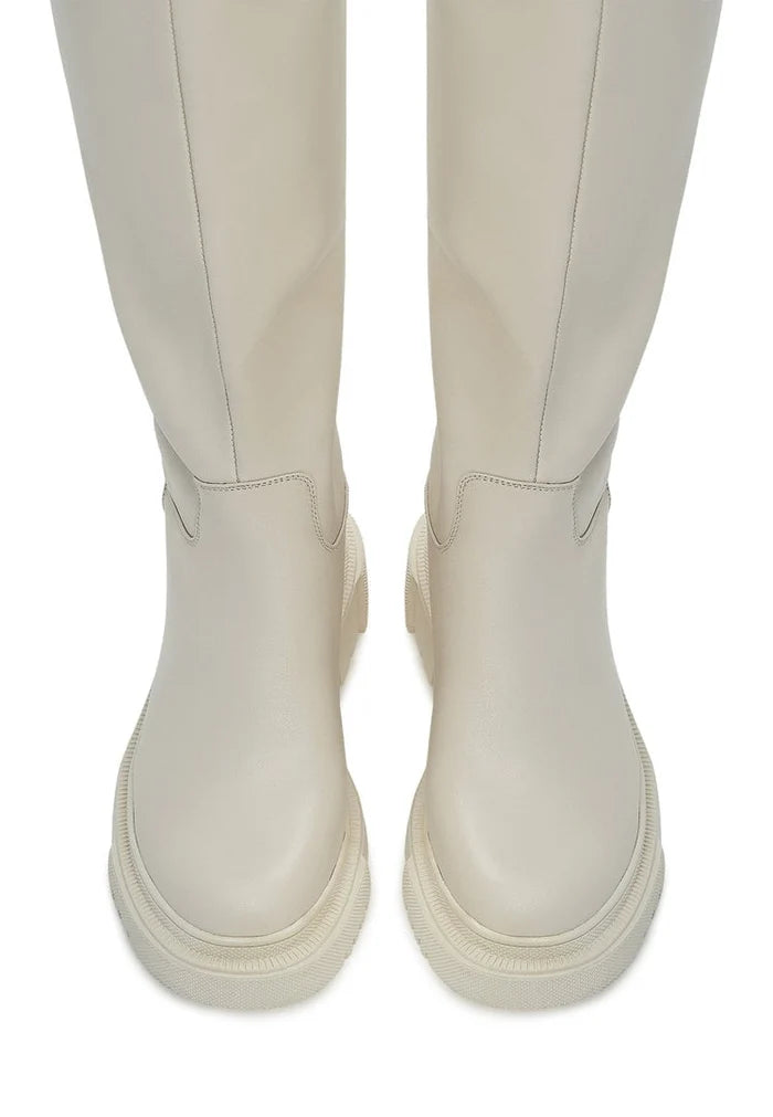 A trendy pair of women's fashion boots, the Anastasia beige leather knee-high boots, are stylish and versatile for any outfit.