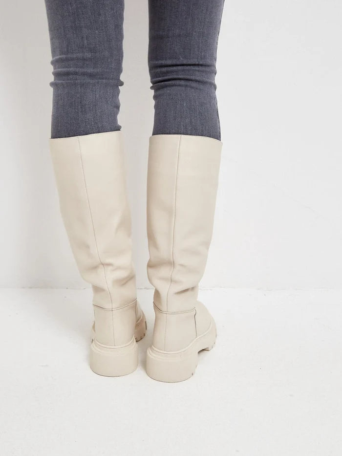 A trendy pair of leather knee-high Anastasia beige boots, perfect for women's fashion, showcasing stylish and sophisticated design.