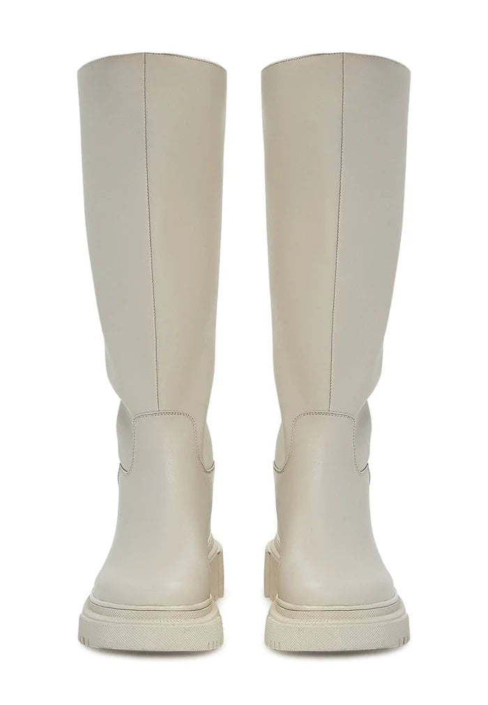 A stylish pair of women's fashion knee-high leather boots in beige, known as the Anastasia beige boots.