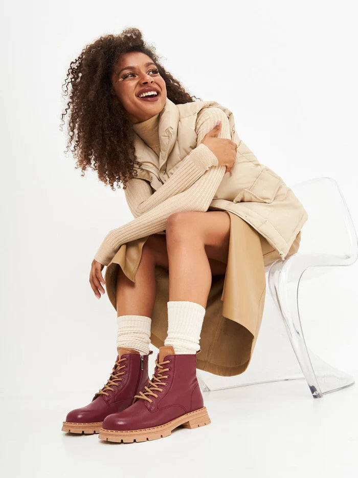 A stylish pair of women's leather ankle lace-up boots in a rich Bordeaux color, perfect for adding a fashionable touch to your footwear collection.