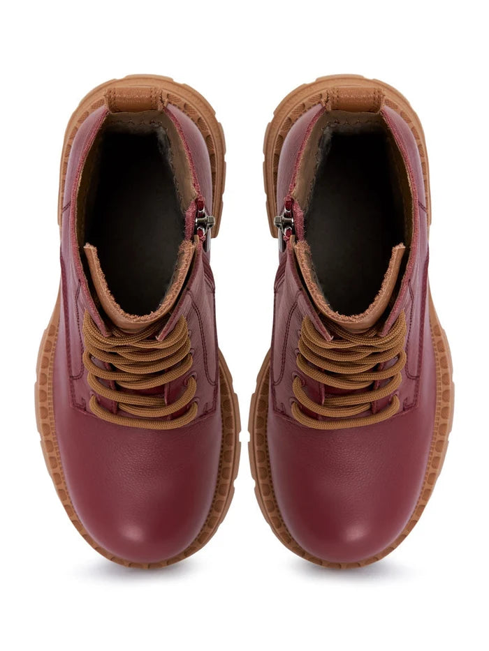 A pair of stylish women's lace-up leather ankle boots in Bordeaux color - must-have fashion footwear.