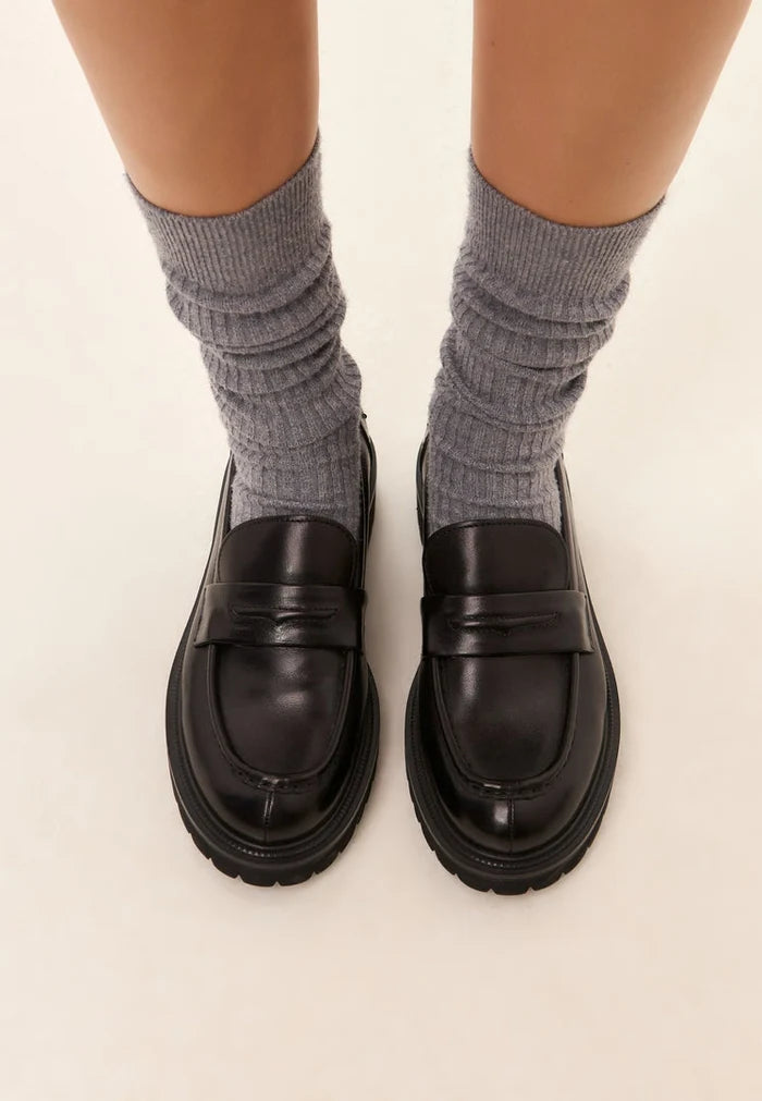 A stylish pair of black leather loafers known as Dennise loafers - perfect leather shoes for men.