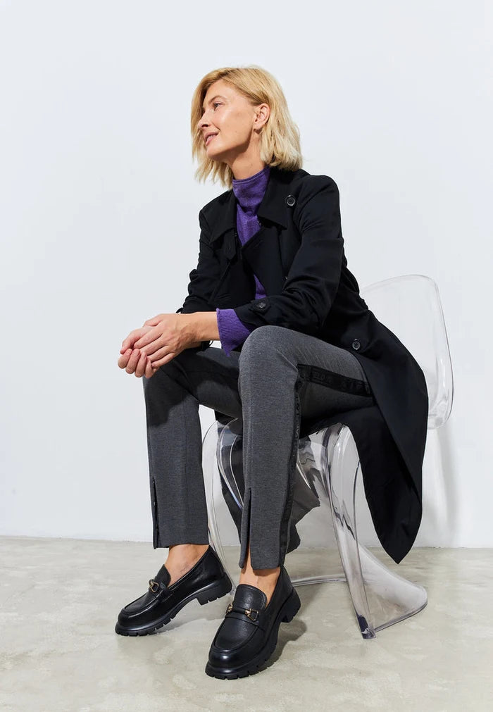 A stylish pair of black leather platform loafers, perfect for women looking for trendy and comfortable slip-on shoes.