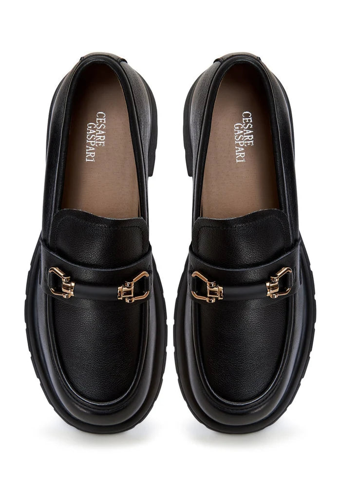 A stylish pair of black leather platform loafers, perfect for women's casual and formal outfits.