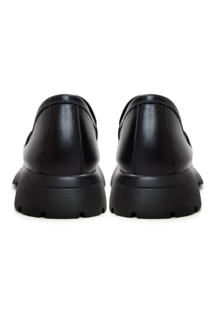 A stylish pair of women's black leather platform loafers - the perfect combination of comfort and chic style for any occasion.