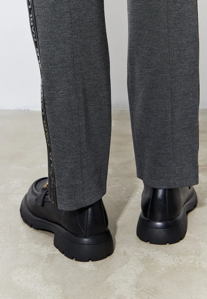 A stylish pair of black leather platform loafers, perfect women's slip-on shoes for a trendy and comfortable look.