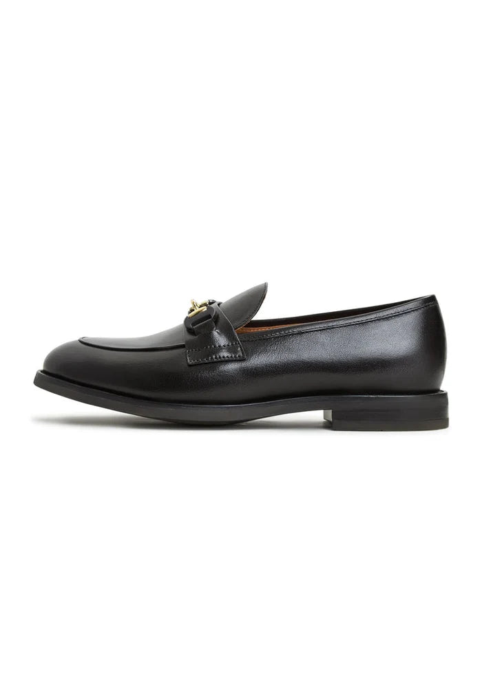 A stylish pair of Olya platform loafers in sleek leather, perfect for adding a bold statement to any outfit.