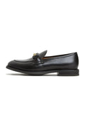 A stylish pair of Olya platform loafers in sleek leather, perfect for adding a bold statement to any outfit.