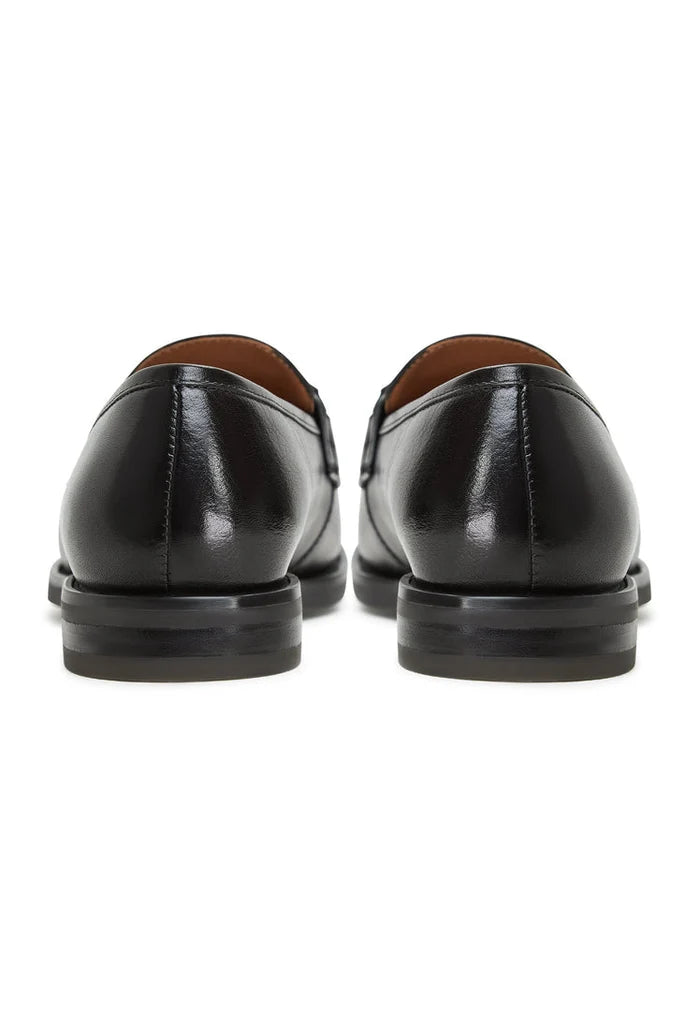 A stylish pair of black leather platform Olya loafers - the perfect blend of comfort and fashion for any outfit.