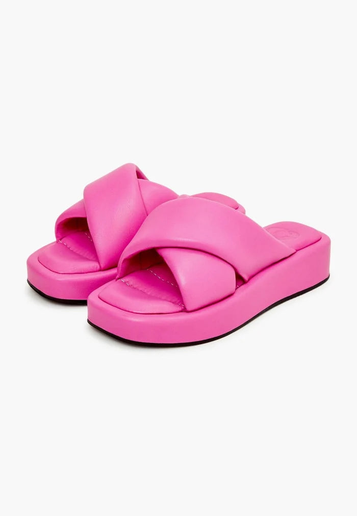 A trendy fuchsia leather platform mule with a chunky heel, perfect for women looking for a fashionable and stylish mule sandal option.