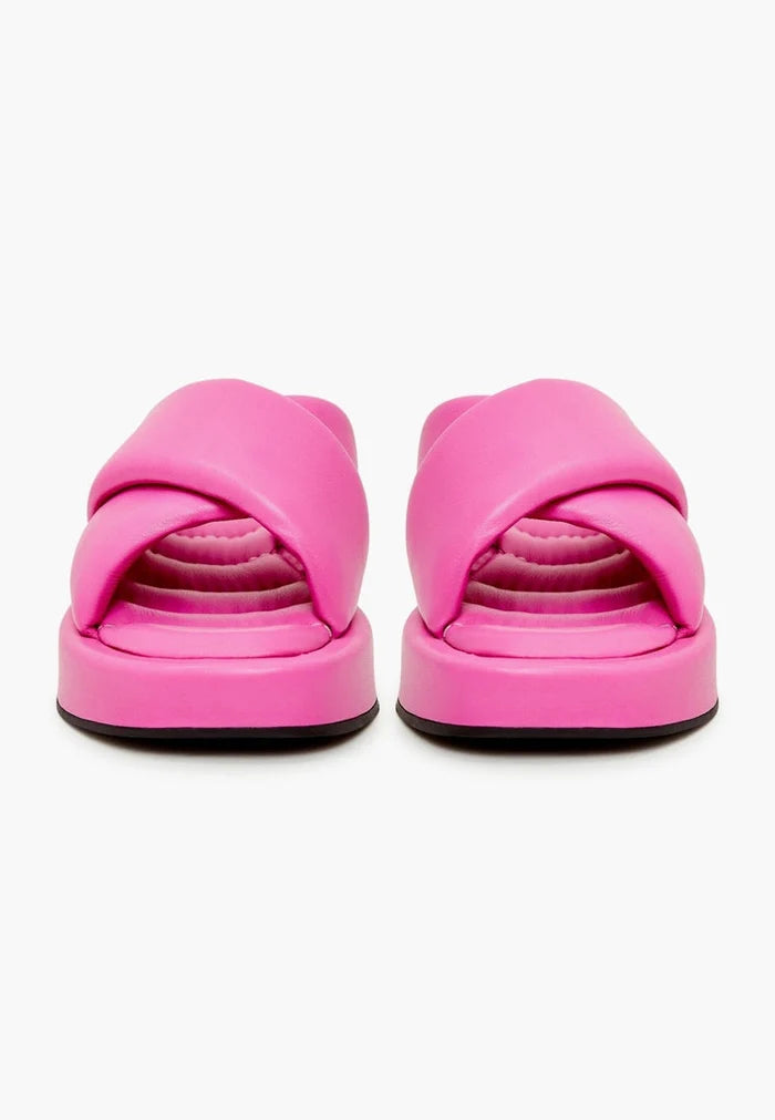 A fashionable fuchsia leather platform mule with a chunky heel for women, a stylish choice for any outfit.
