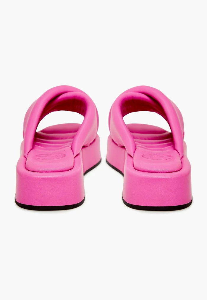 A stylish and fashionable fuchsia leather platform mule with a chunky heel, perfect for any trendy woman.
