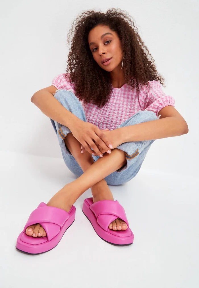 A trendy fuchsia leather platform mule with a chunky heel, a perfect addition to any woman's fashionable footwear collection.