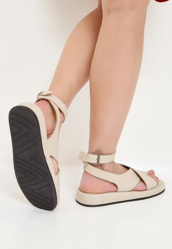 A pair of stylish beige leather platform sandals for women, perfect for summer with high heels.