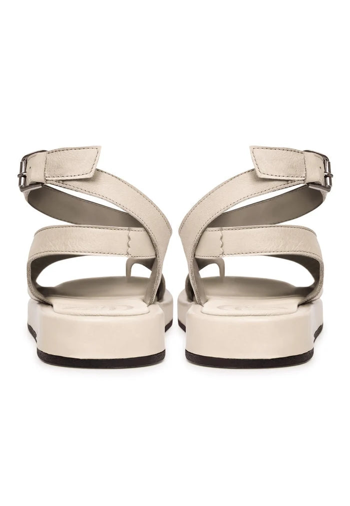 A stylish pair of beige leather platform sandals for women, perfect for summer outings and featuring high heels.