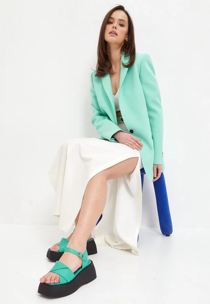 A stylish pair of high heel green leather platform sandals for women, perfect for elevating your footwear game.