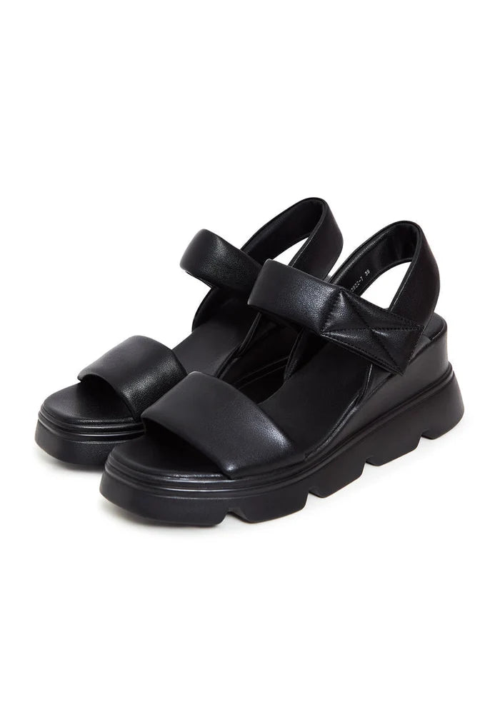 A stylish pair of urban leather platform sandals perfect for adding a touch of chic and comfort to your outfit.