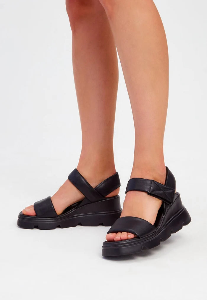 A stylish pair of urban leather platform sandals for a chic city look.