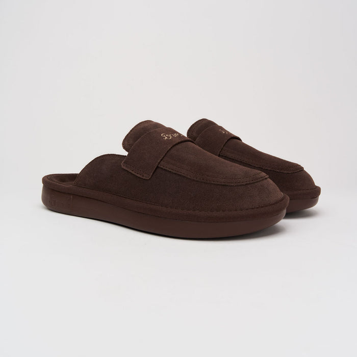 Front three-quarter view of Loafer in dark brown suede showcasing cushioned footbed and low-profile EVA sole on light gray background