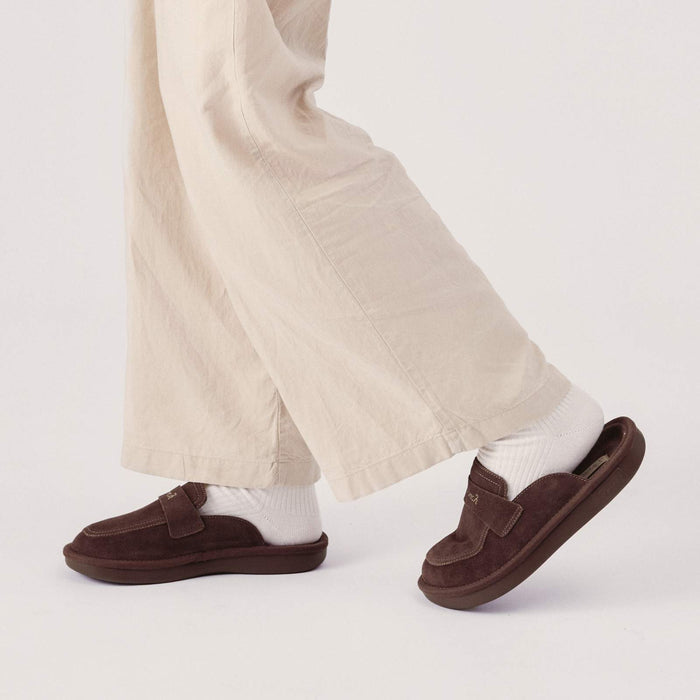 Side view of Dark Brown suede Loafer showing open back cushioned slip on design, moc toe stitching on white studio background