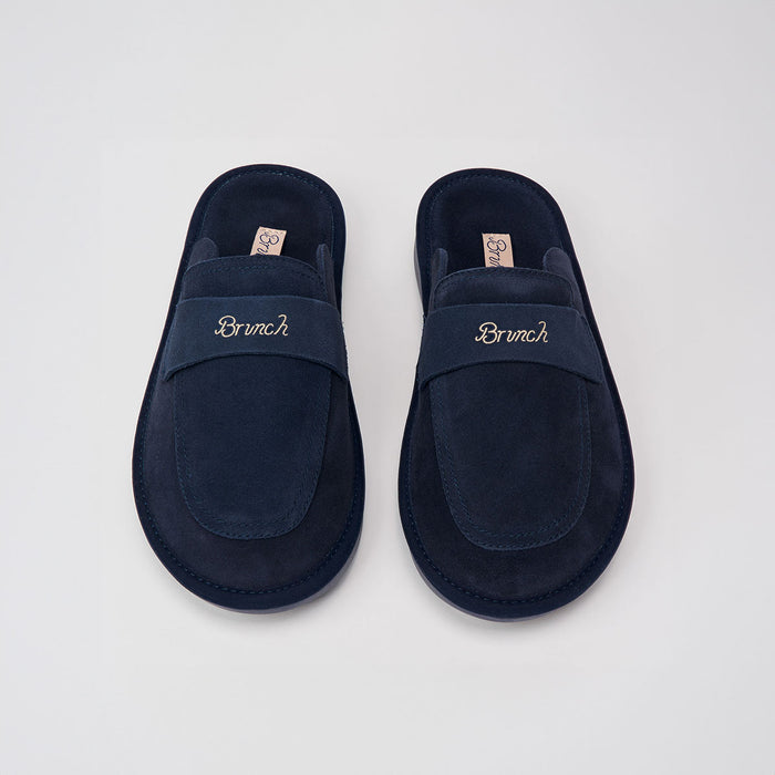 Top-down view of navy suede Loafer showing embroidered Brunch logo on the strap and cushioned insole on light gray background