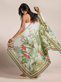 White Manu Garden pareo with green, red, and beige border, held by woman in tank top.