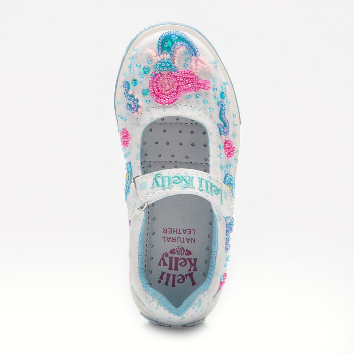 Close-up of Lelli Kelly mermaid shoe beading — pink and aqua hand-stitched sequin embroidery on white canvas