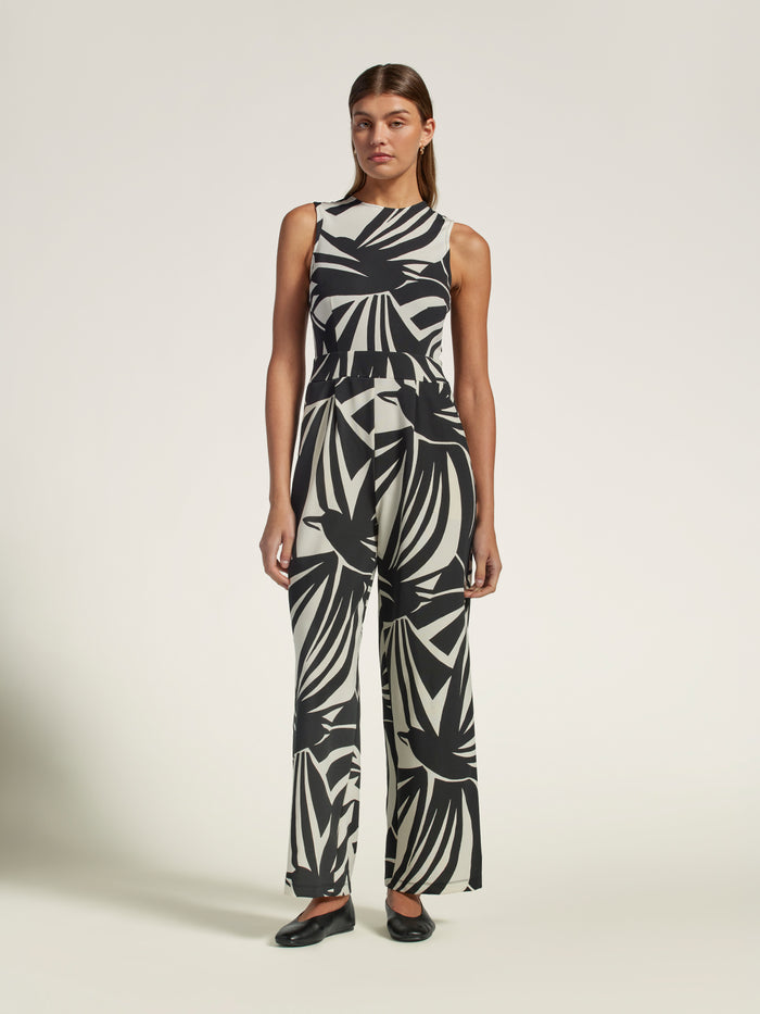 Multicolor geometric-print wide-leg jumpsuit, full-body view with black shoes.