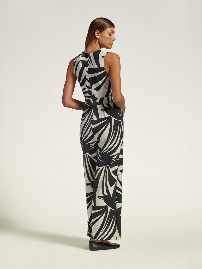Black jeweled-neck jumpsuit with pockets, back view shown in both images.