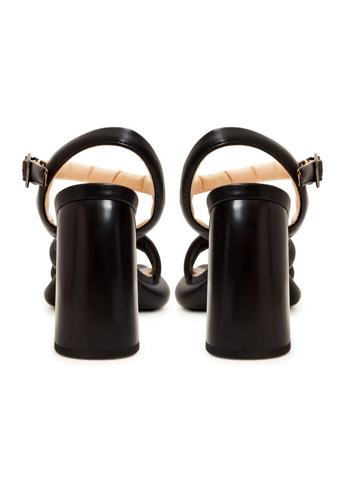 A stylish pair of black leather block heel sandals with an open toe design for women, perfect for a trendy look.
