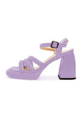 Pair of trendy lilac block heel open toe sandals, perfect for any occasion.