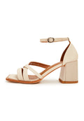 A pair of stylish beige leather block heel sandals for women featuring an open toe design and high heel.
