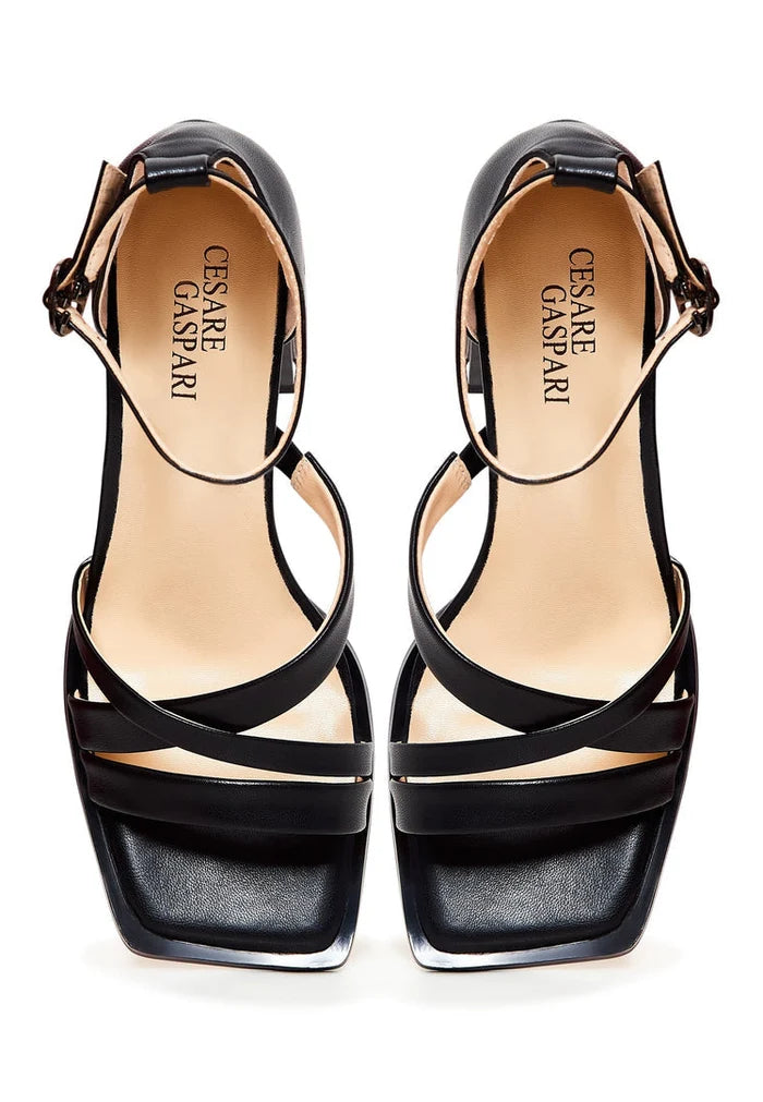 A stylish pair of open toe black leather block heel sandals, ideal for women's footwear fashion.